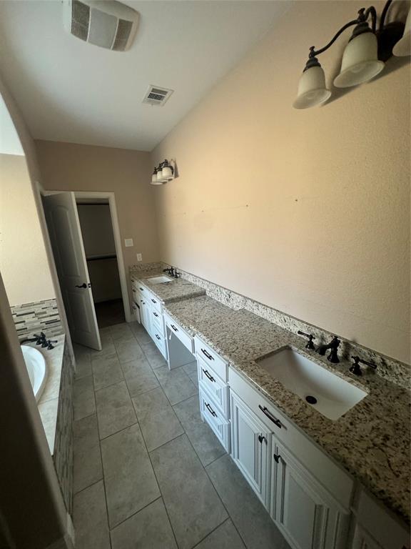 2321 3rd Street Sachse, TX 75048 - Photo 6 of 8 a kitchen with a stove and a sink