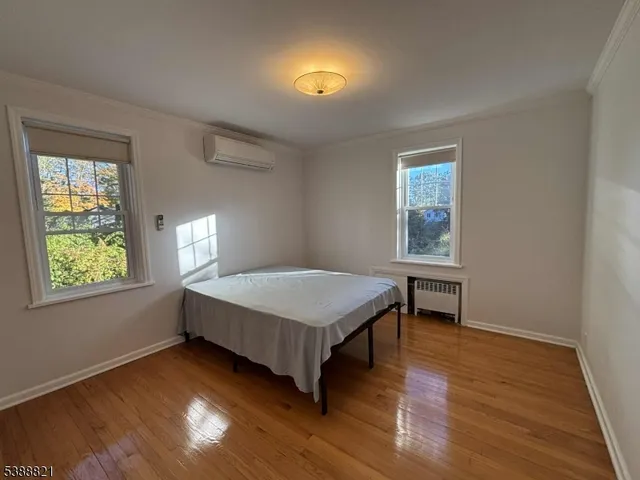 a room with a bed and a window