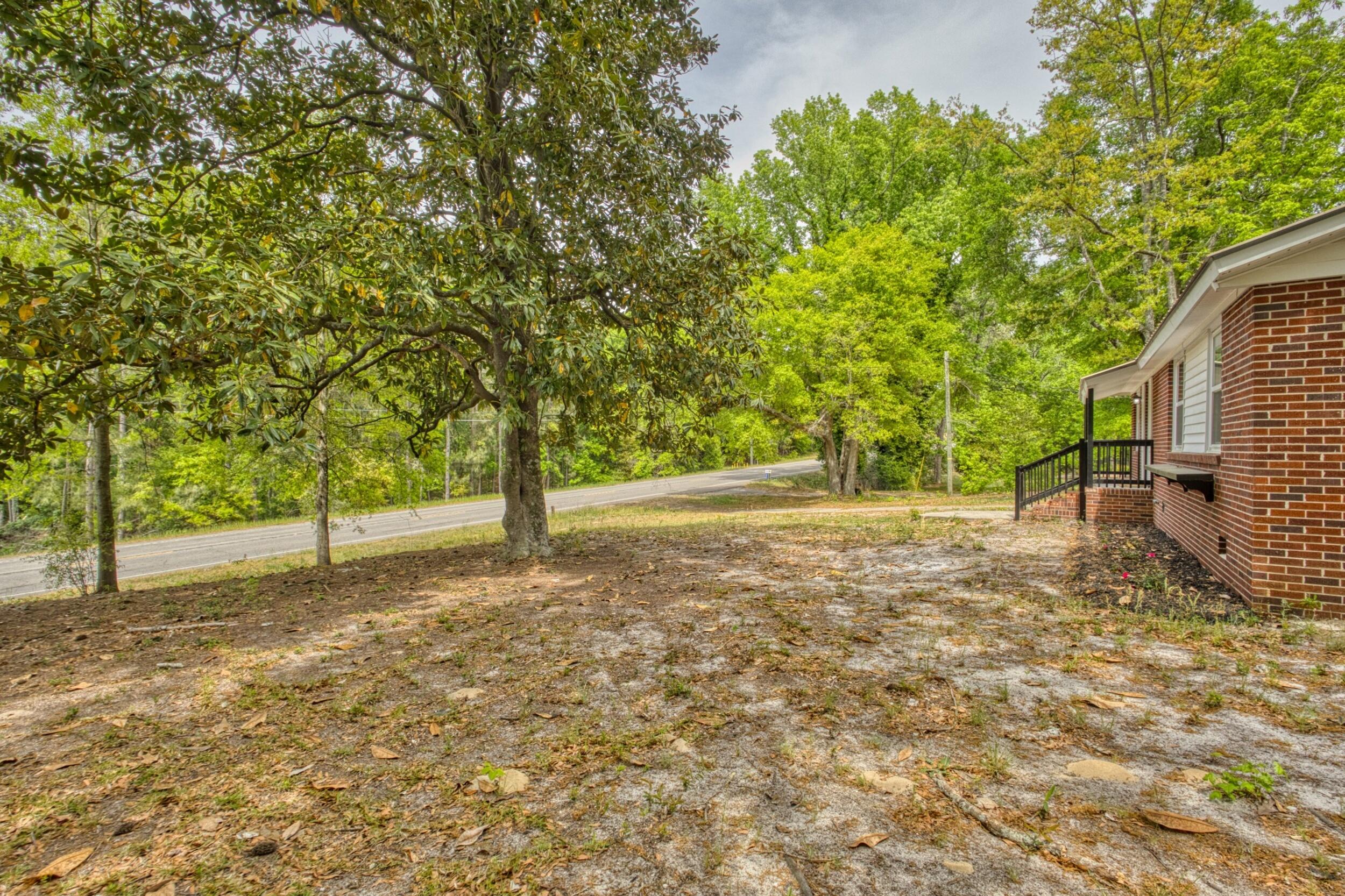 3016 Wagener Road Aiken, SC 29801 - Photo 5 of 29 a backyard of a house with lots of green space