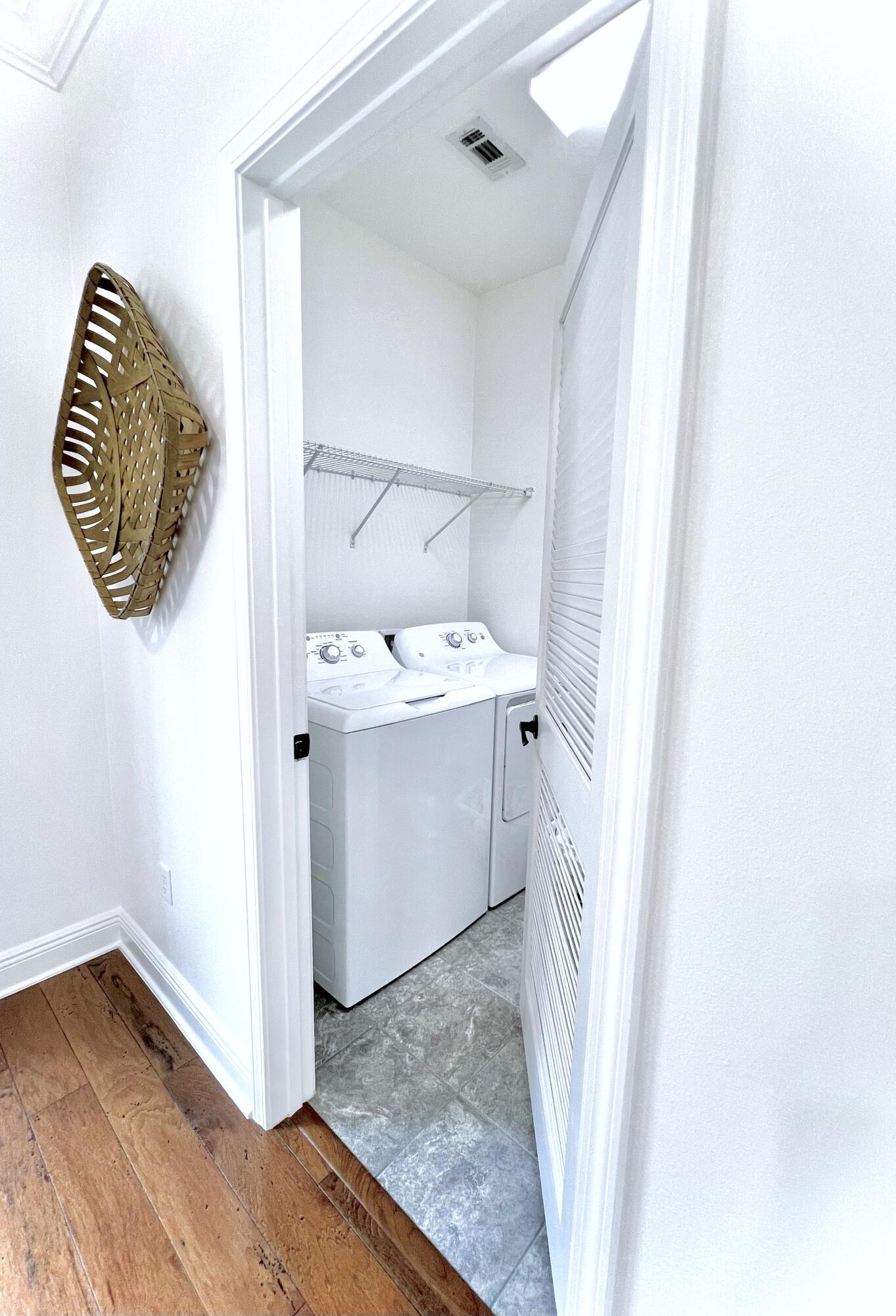 27 Grayling Way Inlet Beach, FL 32461 - Photo 17 of 33 a utility room with a sink a mirror and vanity