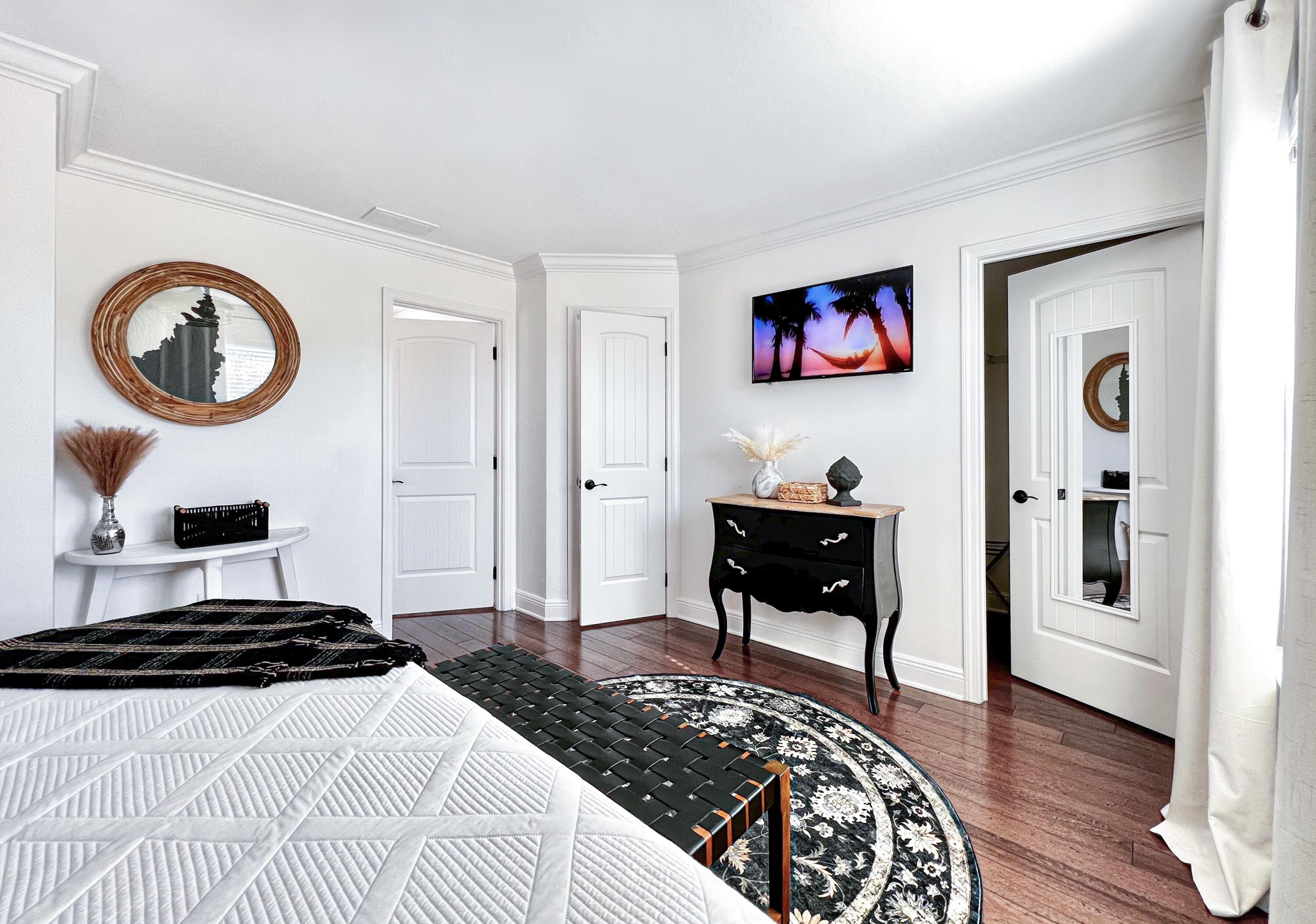 27 Grayling Way Inlet Beach, FL 32461 - Photo 23 of 33 a bedroom with a bed and a table in it