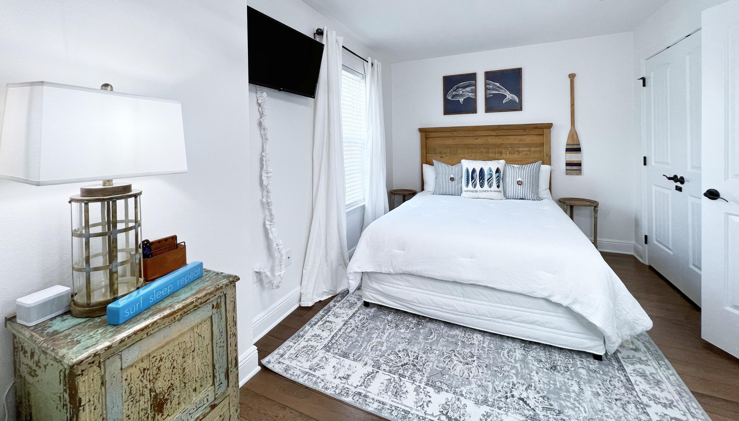 27 Grayling Way Inlet Beach, FL 32461 - Photo 28 of 33 a bedroom with a bed and wooden floor