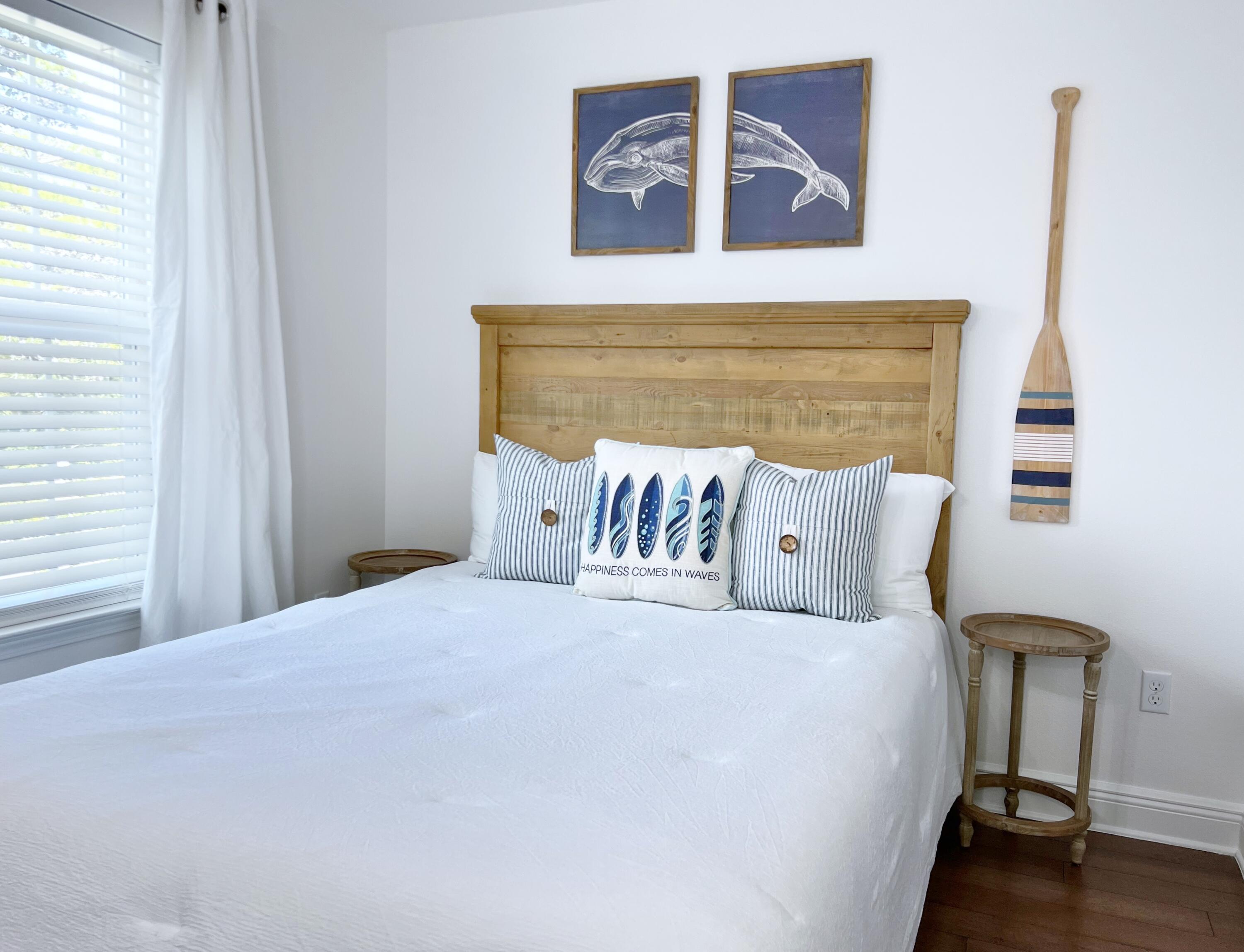 27 Grayling Way Inlet Beach, FL 32461 - Photo 4 of 33 a bed sitting in a bedroom next to a window