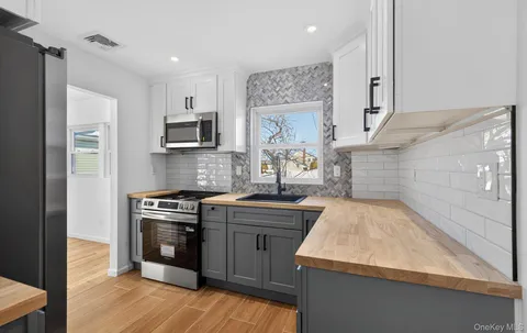 a kitchen with a sink stove and refrigerator