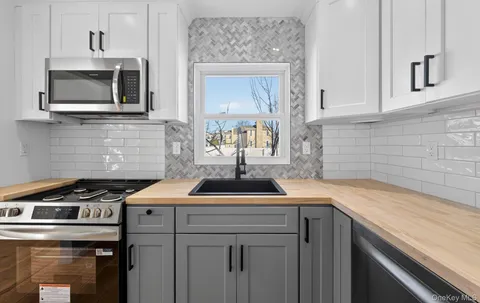 a kitchen with a sink and cabinets