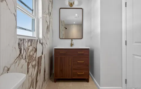 a bathroom with a sink and a mirror