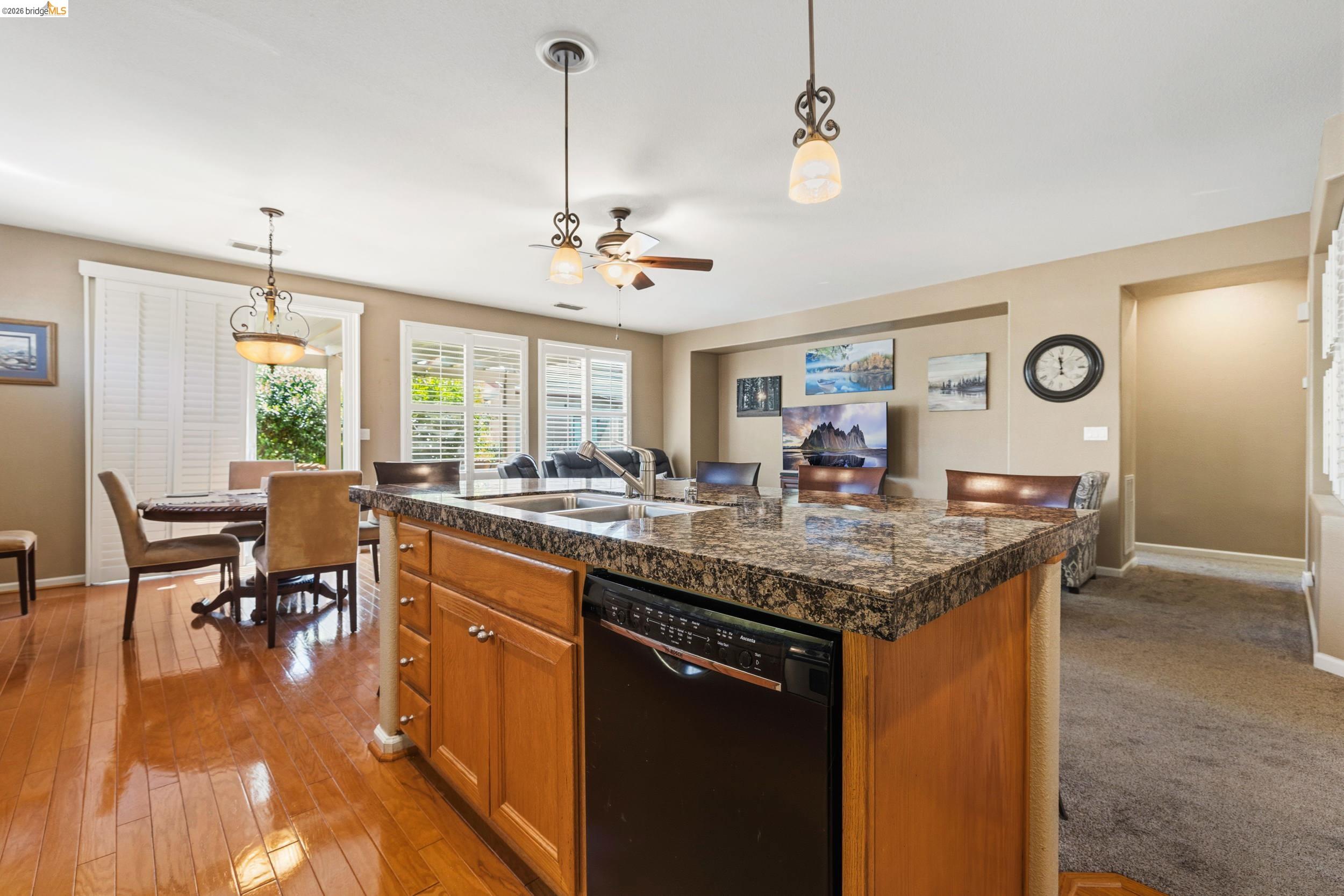 1063 Waterwood Drive Rio Vista, CA 94571 - Photo 15 of 38 a living room with granite countertop kitchen island furniture and a chandelier