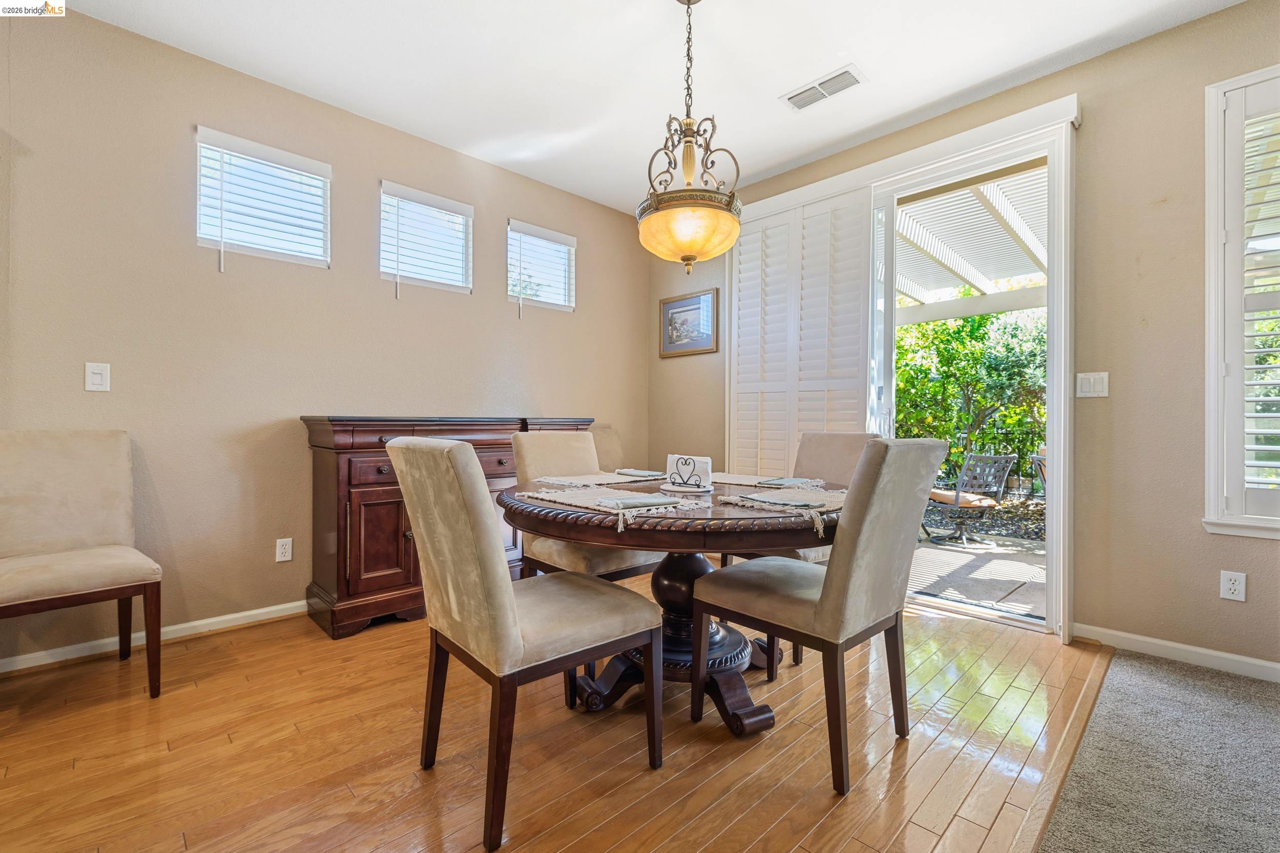 1063 Waterwood Drive Rio Vista, CA 94571 - Photo 18 of 38 a view of a dining room with furniture window and wooden floor