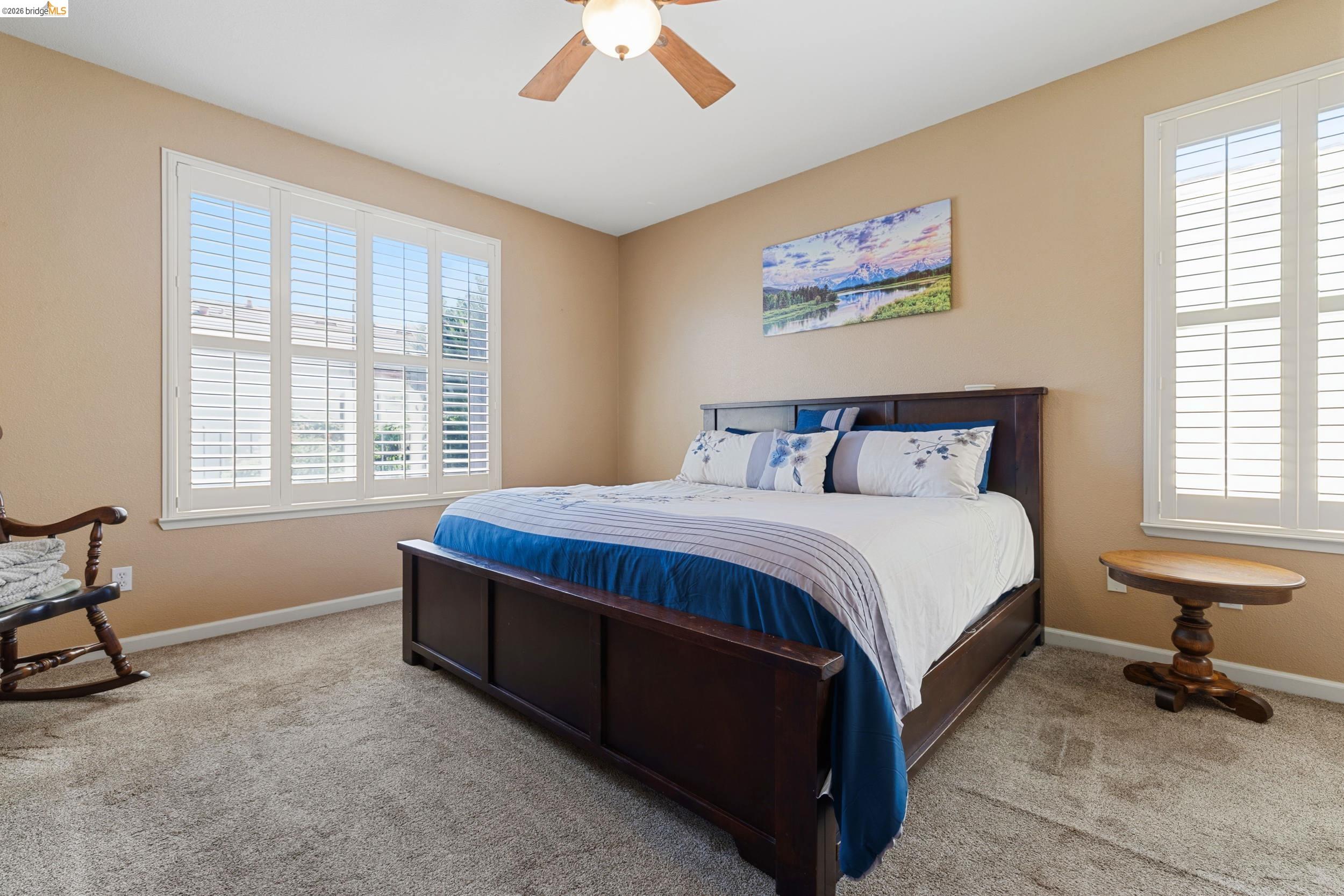 1063 Waterwood Drive Rio Vista, CA 94571 - Photo 23 of 38 a bedroom with a bed and chair