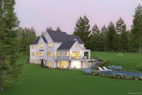 a front view of house with yard and green space