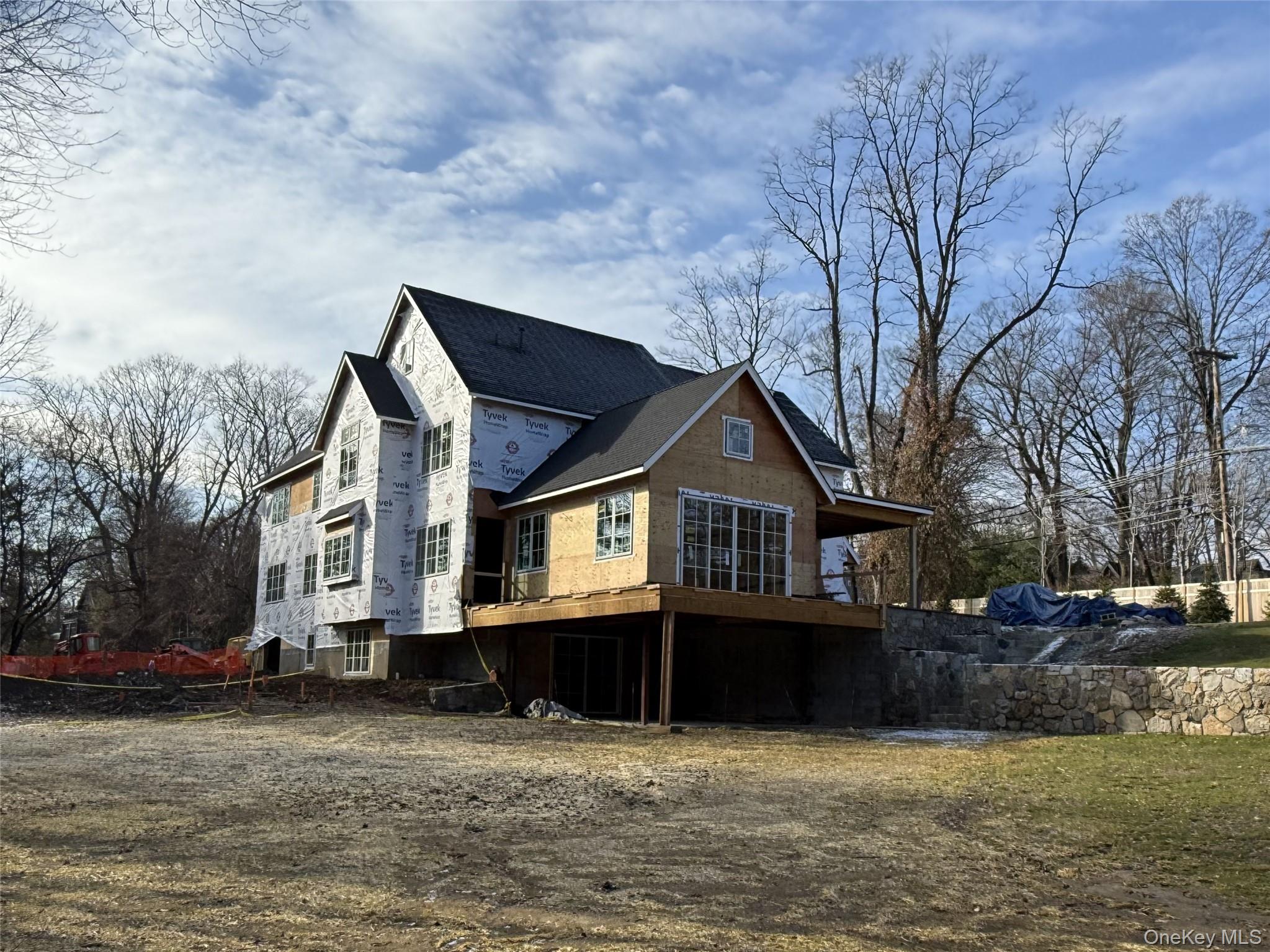 211 Bedford Road Chappaqua, NY 10514 - Photo 5 of 21 a front view of a house with a yard