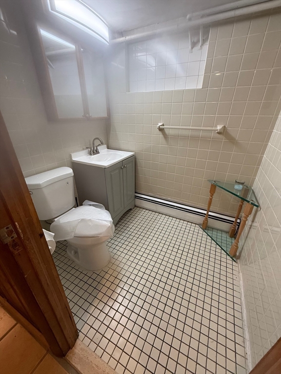 311 Ridge Street Arlington, MA 02474 - Photo 15 of 15 a bathroom with a sink toilet and shower