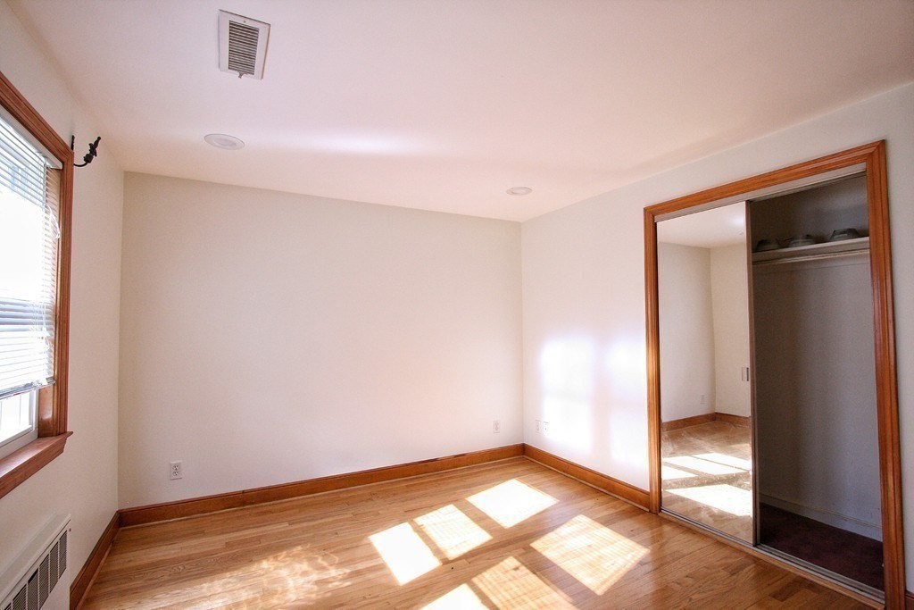 311 Ridge Street Arlington, MA 02474 - Photo 5 of 15 a view of an empty room and window