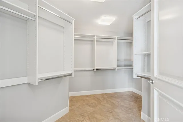 a view of an empty walk in closet