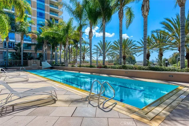 a view of swimming pool with chairs