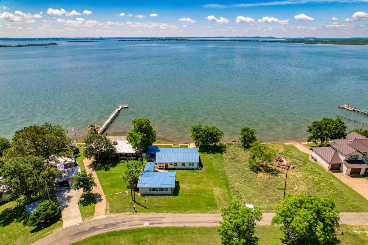 809 Lakeshore Loop Tow, TX 78672 - Photo 2 of 33 an aerial view of a house with a garden
