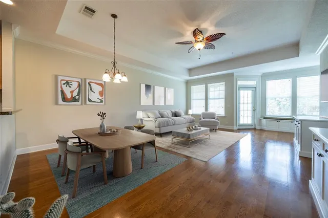 a view of a dining room with furniture window and wooden floor