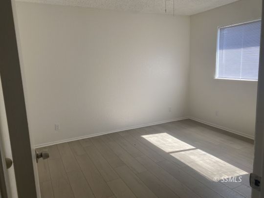 201 South Sunset Street Ridgecrest, CA 93555 - Photo 13 of 20 an empty room with a window