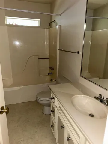 an empty room with closet area