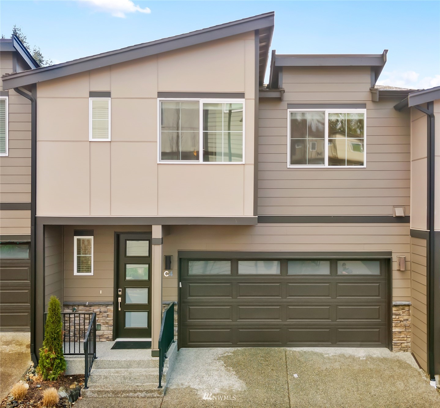 a front view of a house with a garage