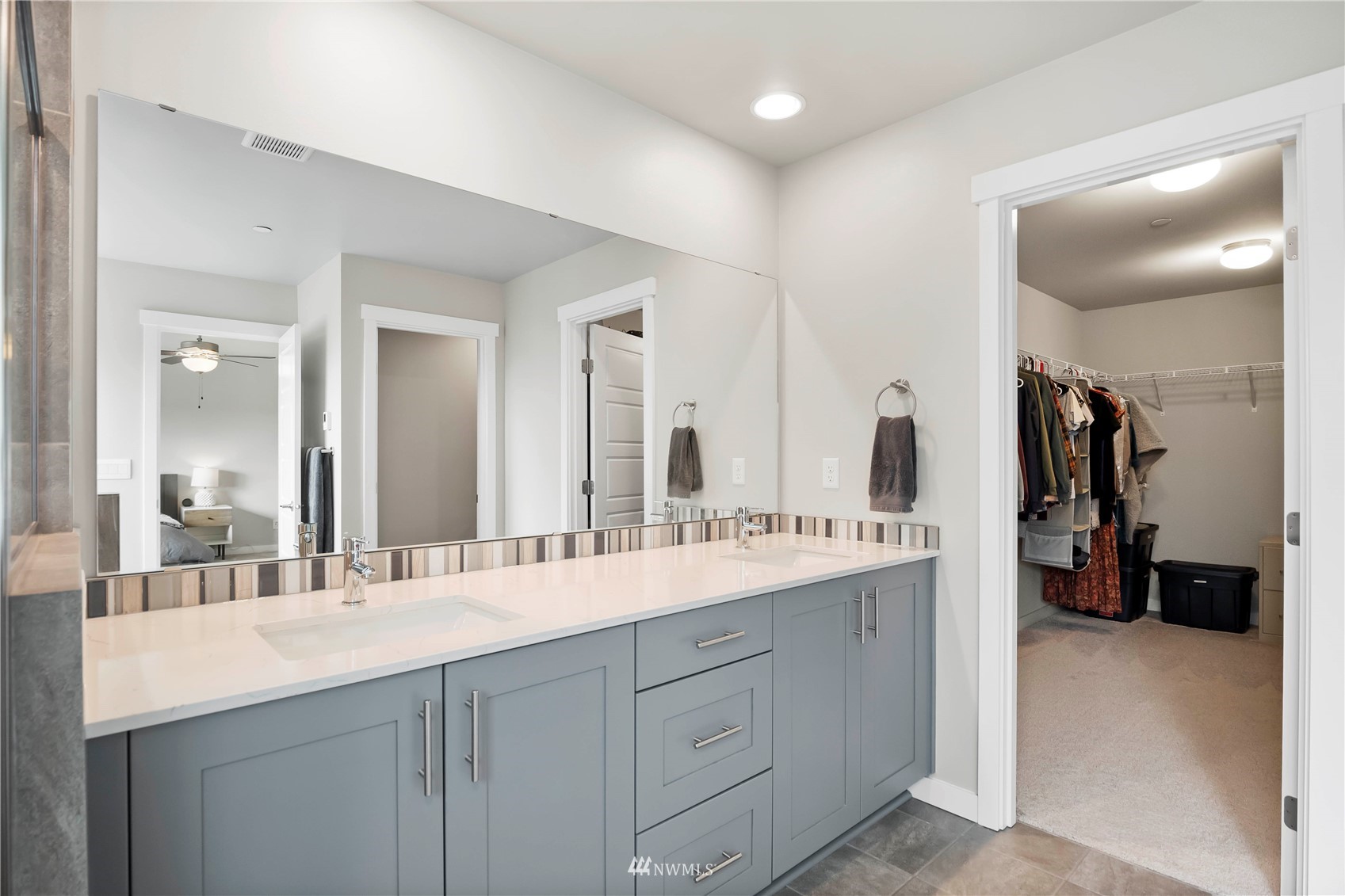 1325 Seattle Hill Road, Unit C4 Bothell, WA 98012 - Photo 15 of 33 a bathroom with a double vanity sink and a mirror