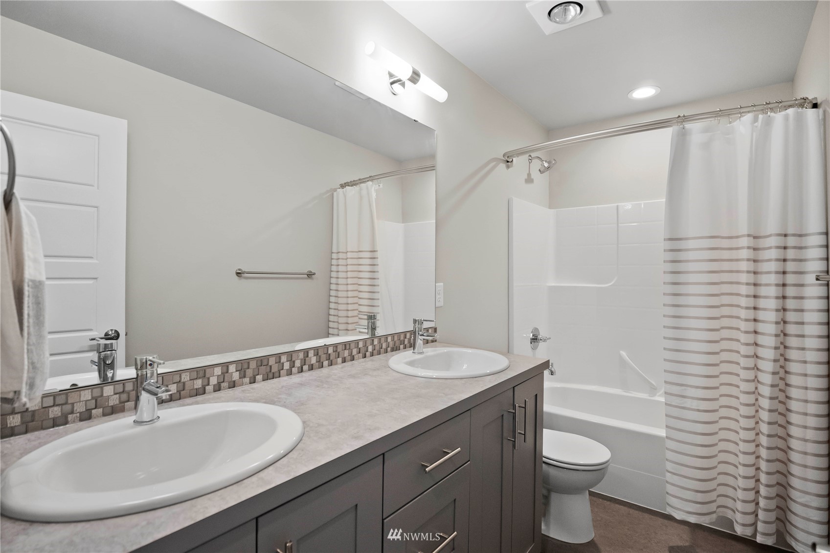 1325 Seattle Hill Road, Unit C4 Bothell, WA 98012 - Photo 18 of 33 a bathroom with a granite countertop sink toilet and shower