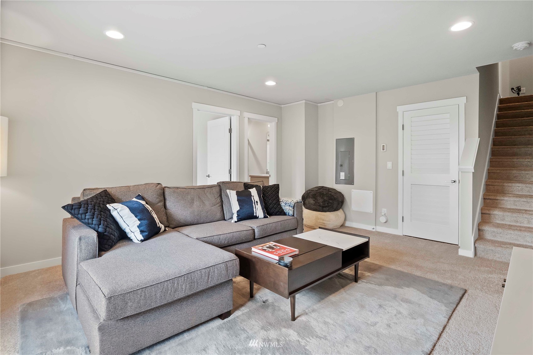 1325 Seattle Hill Road, Unit C4 Bothell, WA 98012 - Photo 23 of 33 a living room with furniture a white wall and a large mirror next to a window