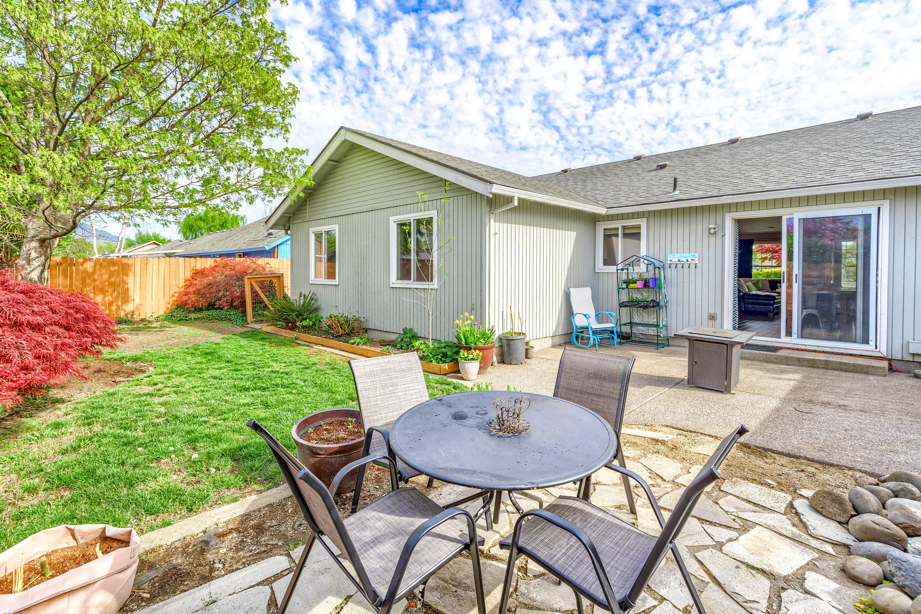 403 Mace Road Medford, OR 97501 - Photo 27 of 33 a view of a backyard with table and chairs and a yard