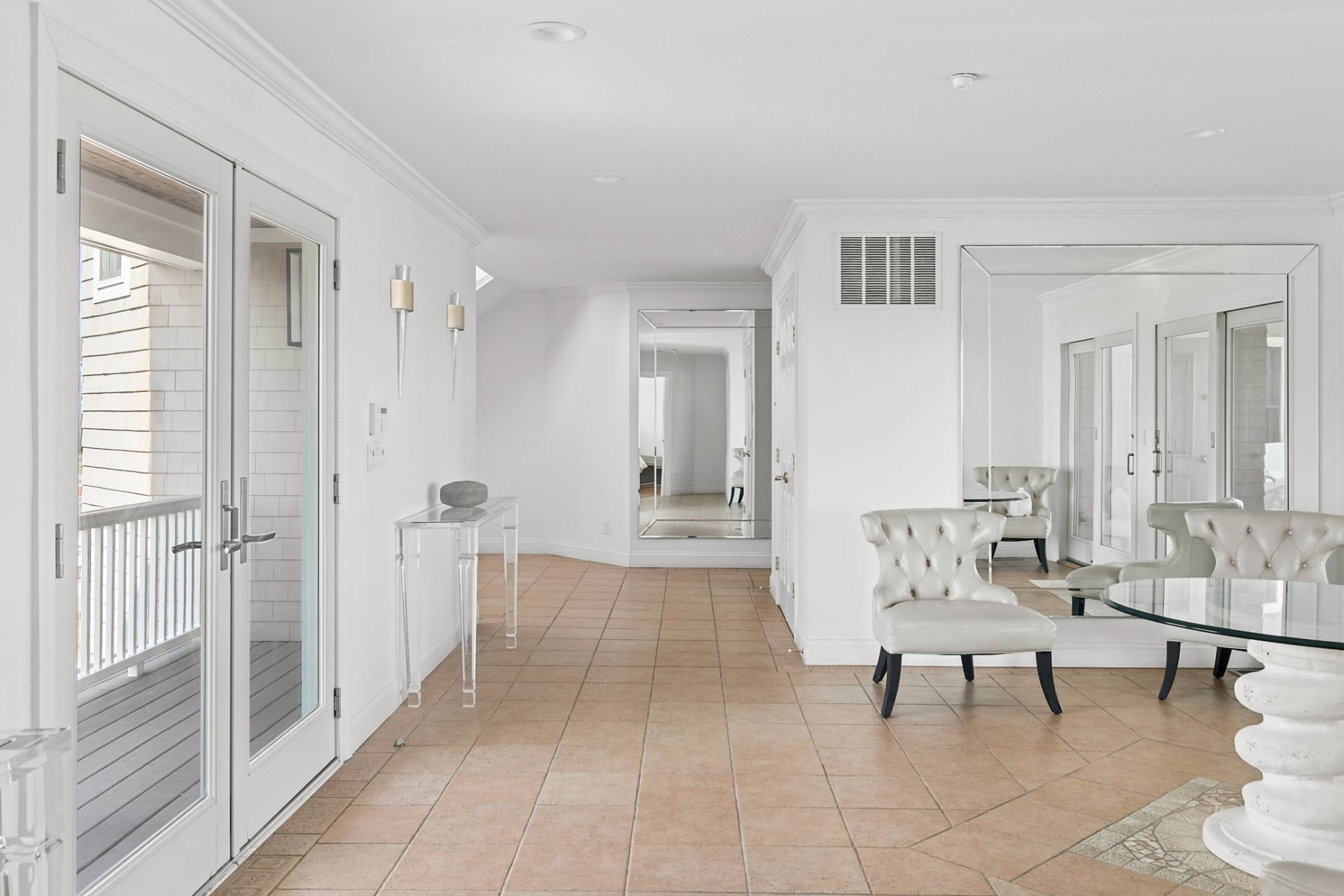 687 Dune Road Westhampton Beach, NY 11978 - Photo 21 of 24 a living room with furniture and a table