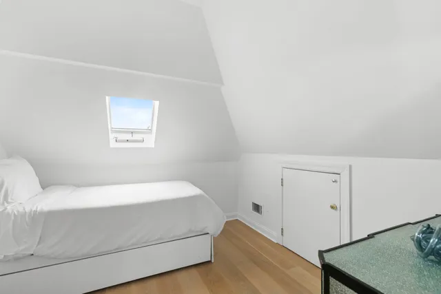 a room with a bed and a window