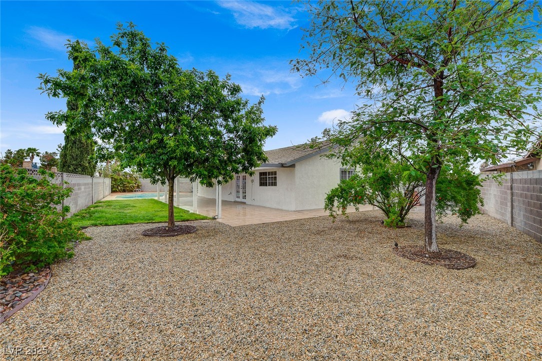 4430 Eureka Circle Las Vegas, NV 89103 - Photo 32 of 39 View of yard featuring a fenced backyard and a pat