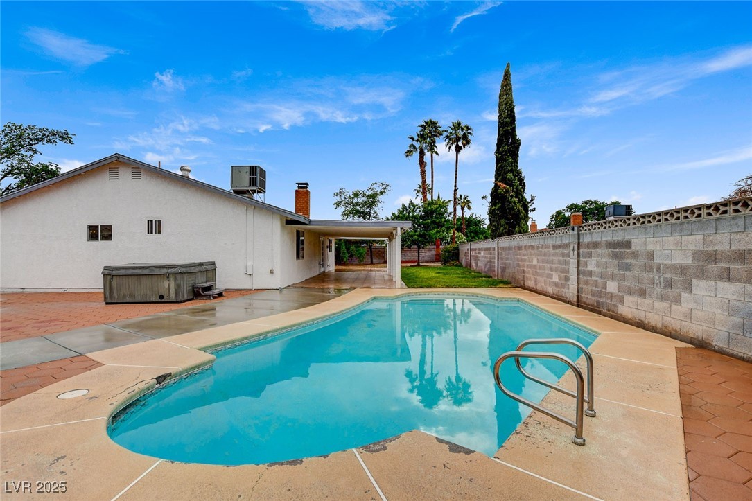 4430 Eureka Circle Las Vegas, NV 89103 - Photo 36 of 39 View of swimming pool with central AC, a hot tub,