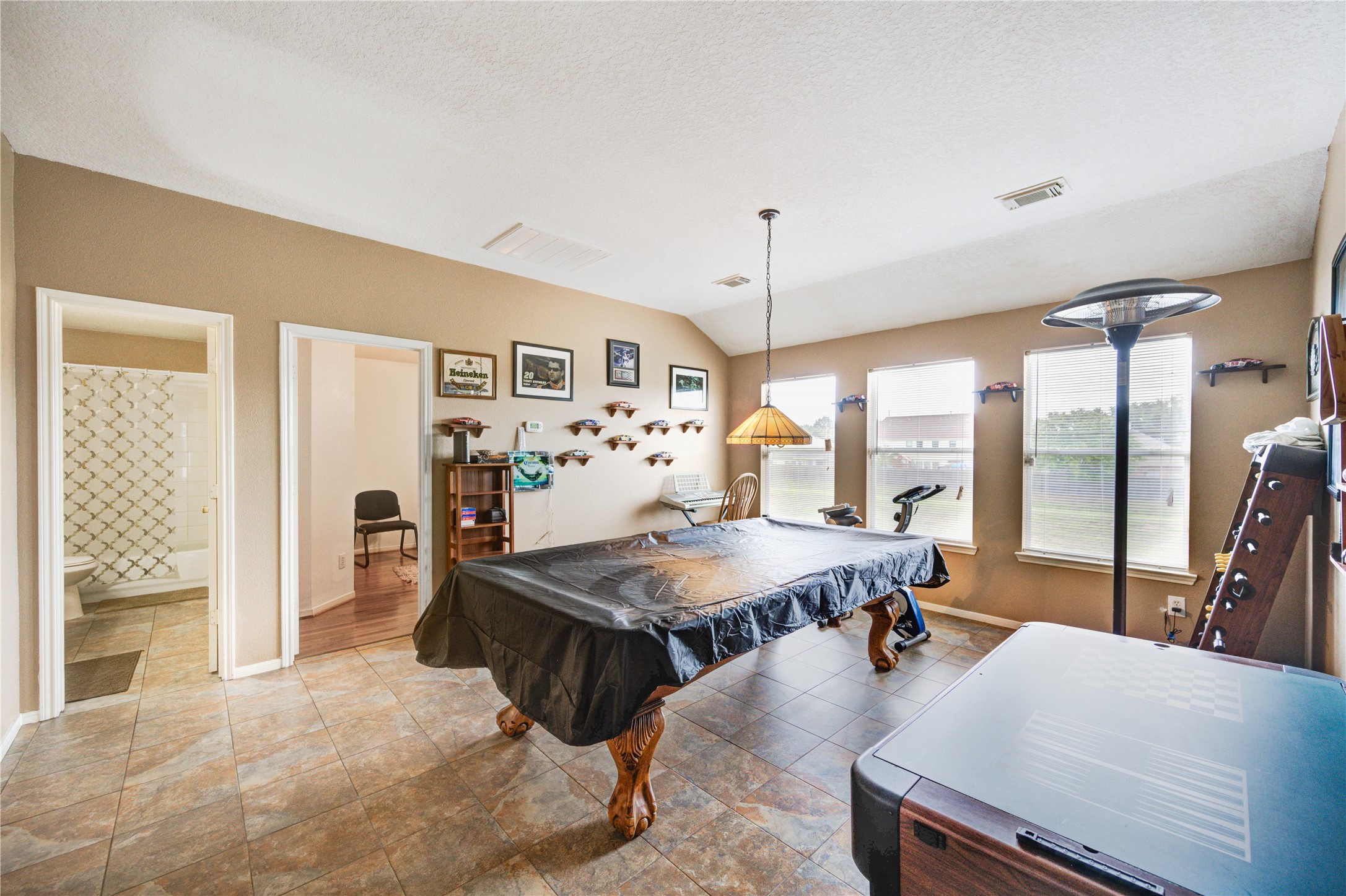 16730 Spring Barker Drive Cypress, TX 77429 - Photo 42 of 50 a living room with furniture pool view and large windows