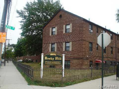 202-06 Rocky Hill Road, Unit C1 Queens, NY 11361 - Photo 1 of 1 a sign on the side of a building