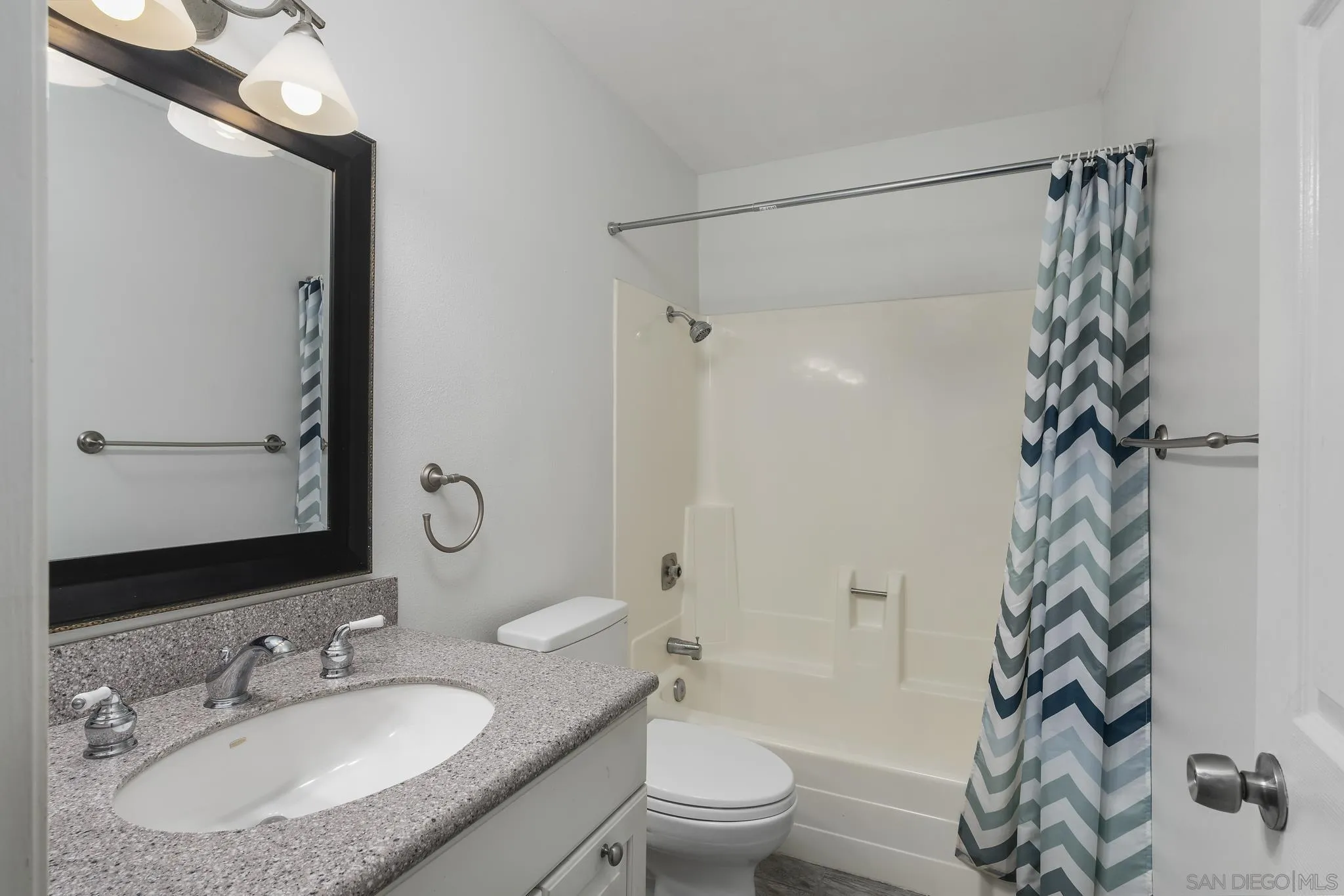 183 Countryhaven Road Encinitas, CA 92024 - Photo 11 of 28 a bathroom with a sink toilet a mirror a vanity and shower