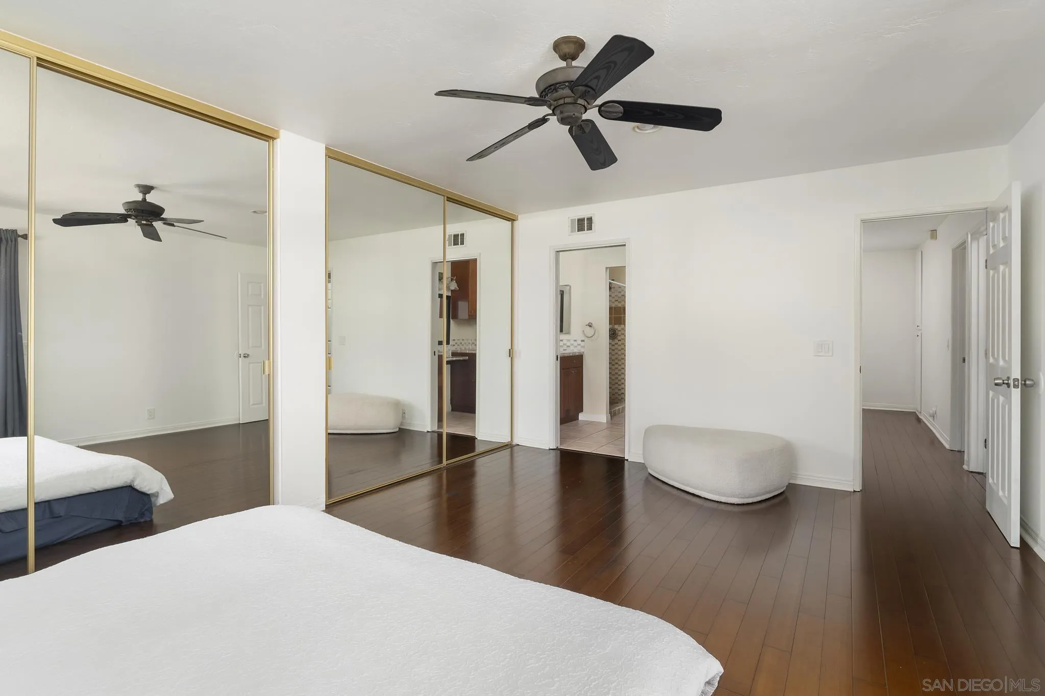183 Countryhaven Road Encinitas, CA 92024 - Photo 15 of 28 a view of a livingroom with wooden floor and a ceiling fan