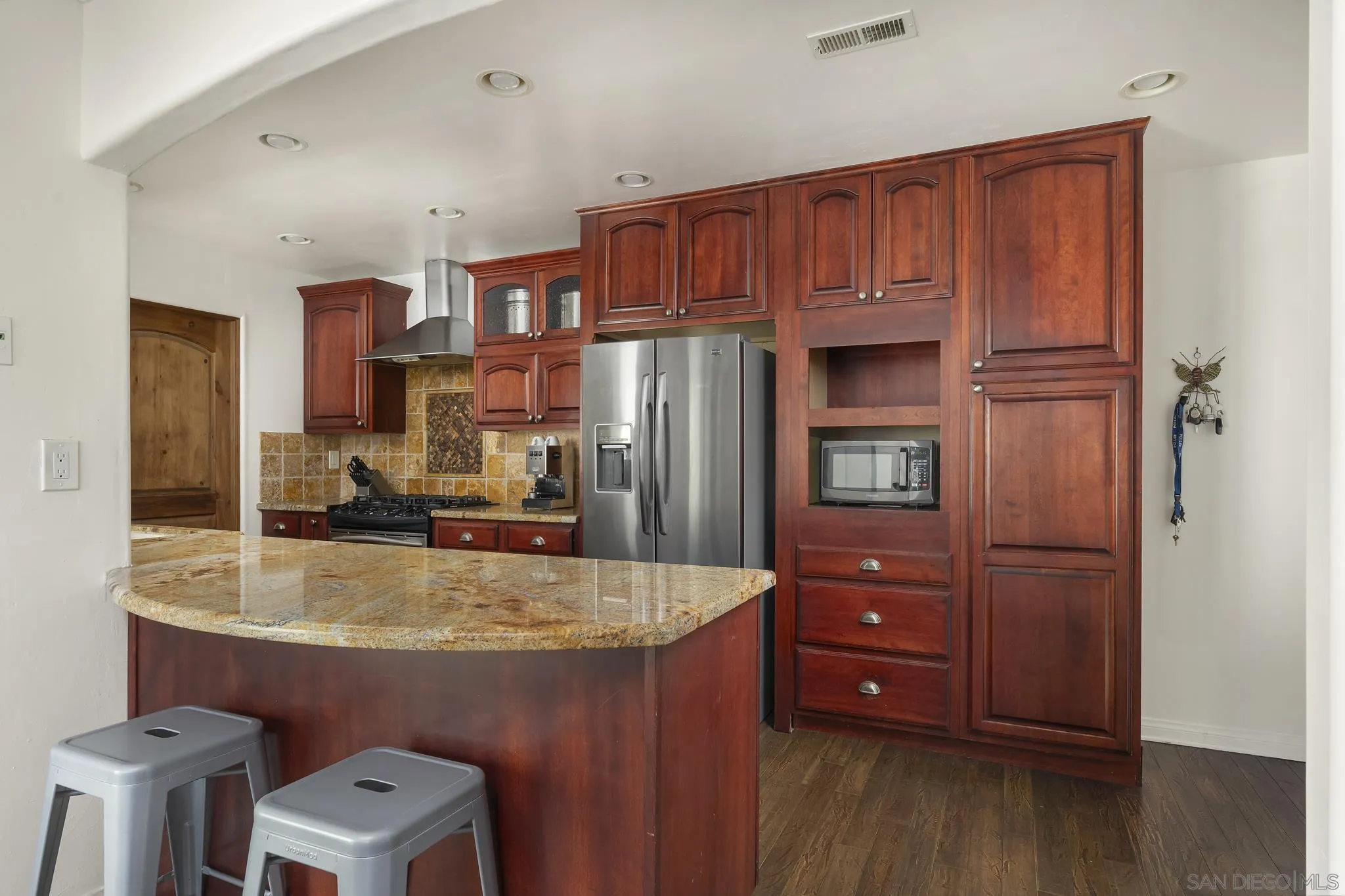 183 Countryhaven Road Encinitas, CA 92024 - Photo 2 of 28 a kitchen with a refrigerator and a sink