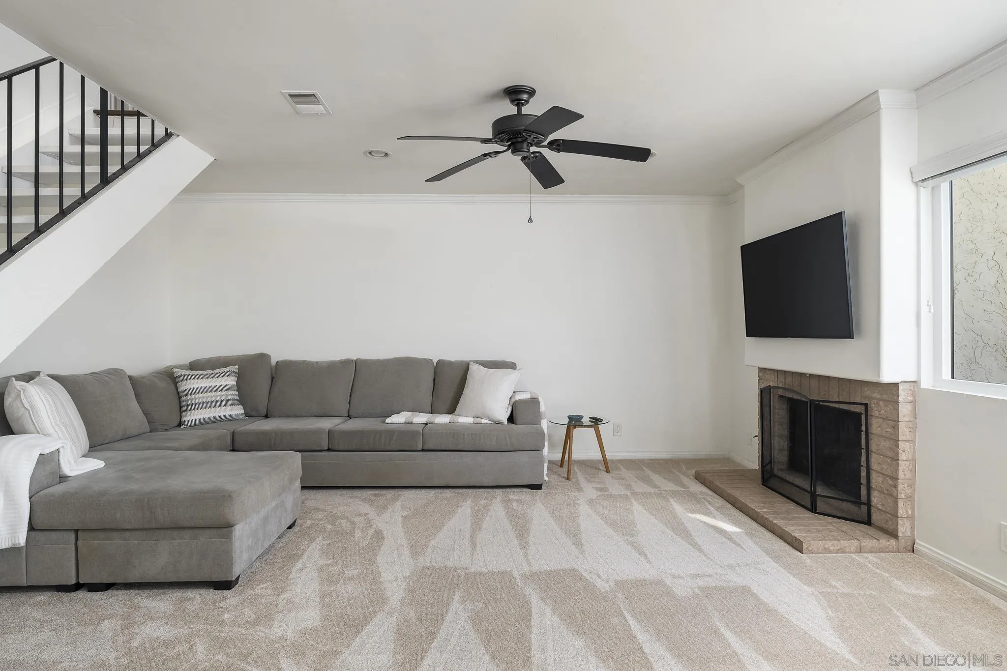 183 Countryhaven Road Encinitas, CA 92024 - Photo 4 of 28 a living room with furniture and a flat screen tv