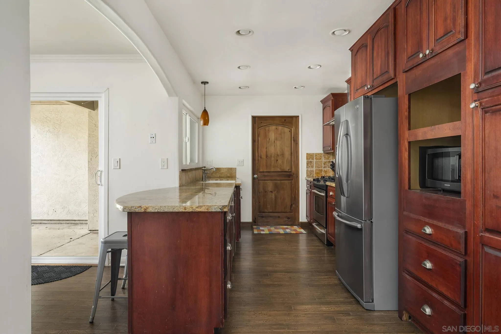 183 Countryhaven Road Encinitas, CA 92024 - Photo 5 of 28 a kitchen with stainless steel appliances granite countertop a refrigerator and a sink