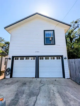 a front view of a house with a garage
