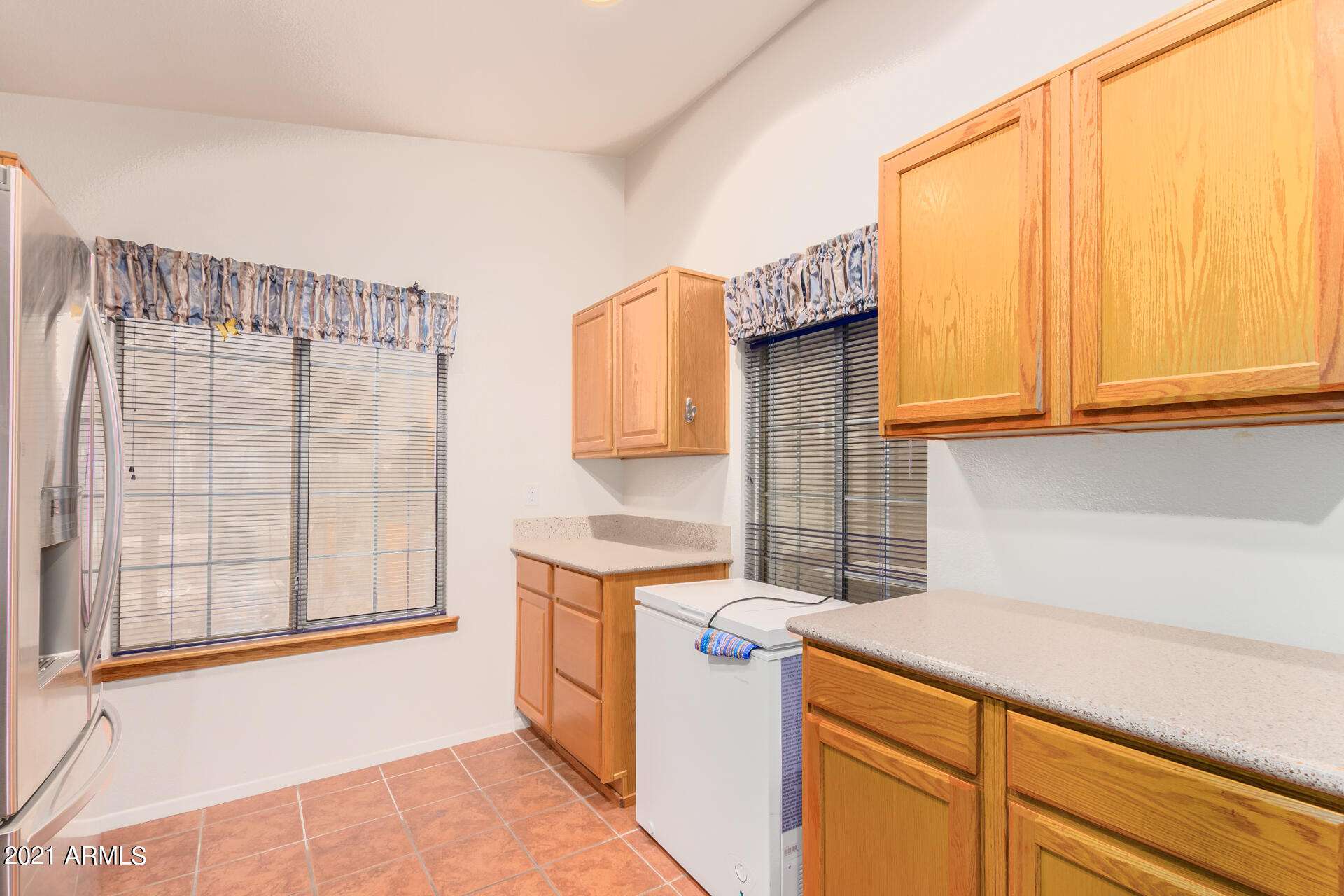 4138 West Bloomfield Road Phoenix, AZ 85029 - Photo 9 of 28 a kitchen with stainless steel appliances granite countertop a sink and a window