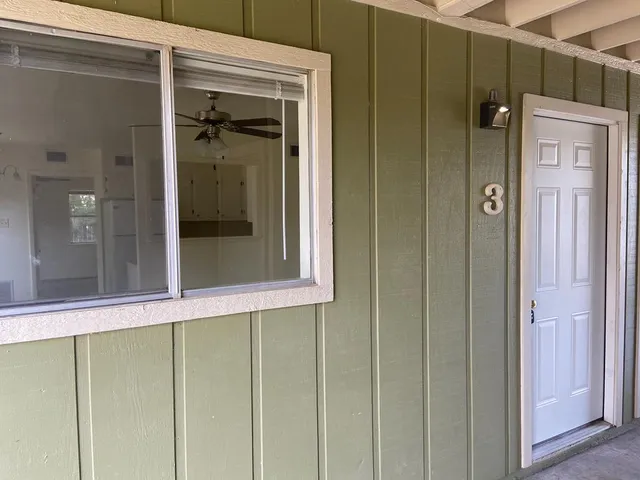 a white refrigerator freezer sitting inside of a kitchen