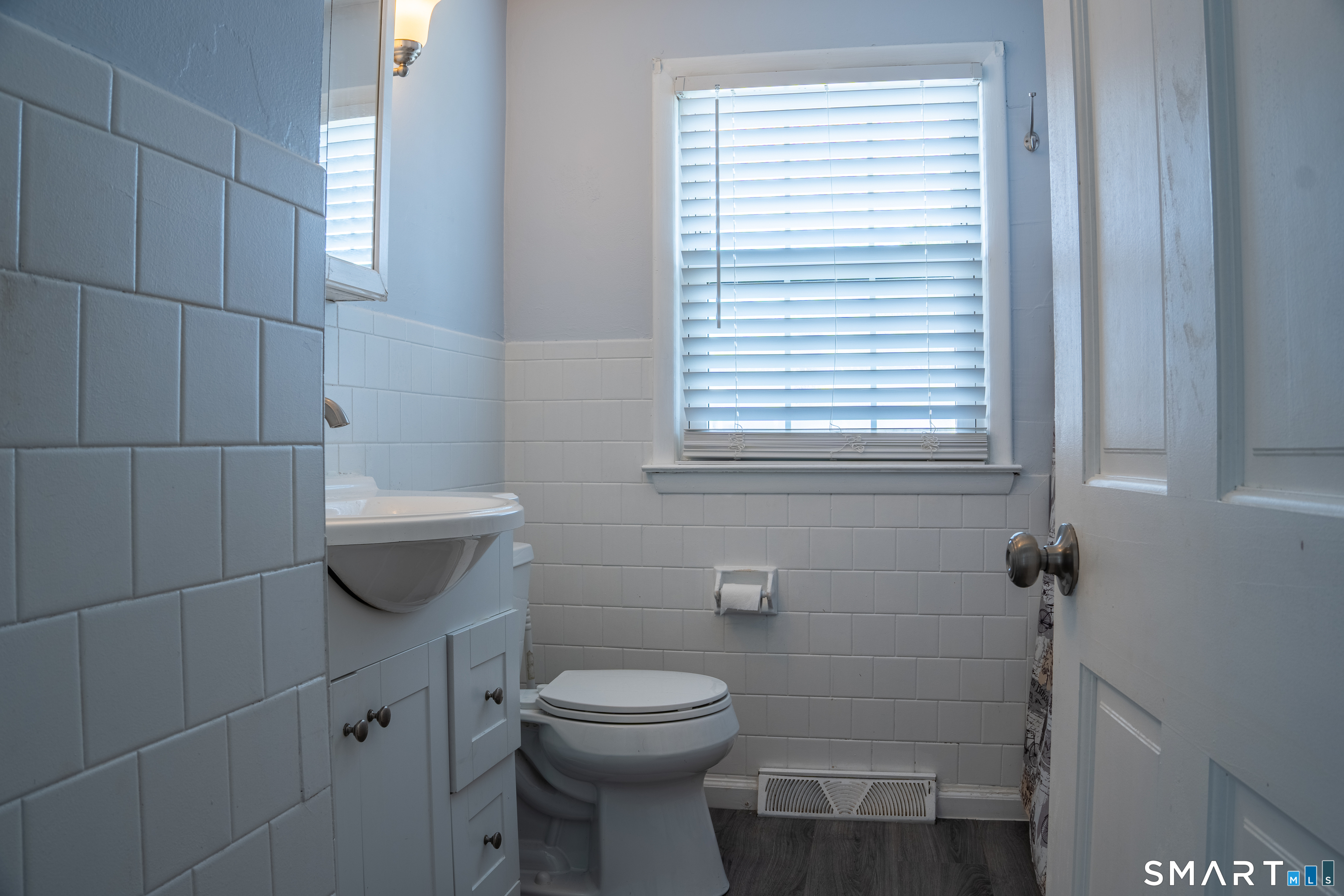 18 Leon Street Thompson, CT 06277 - Photo 12 of 17 a bathroom with a toilet a sink and window
