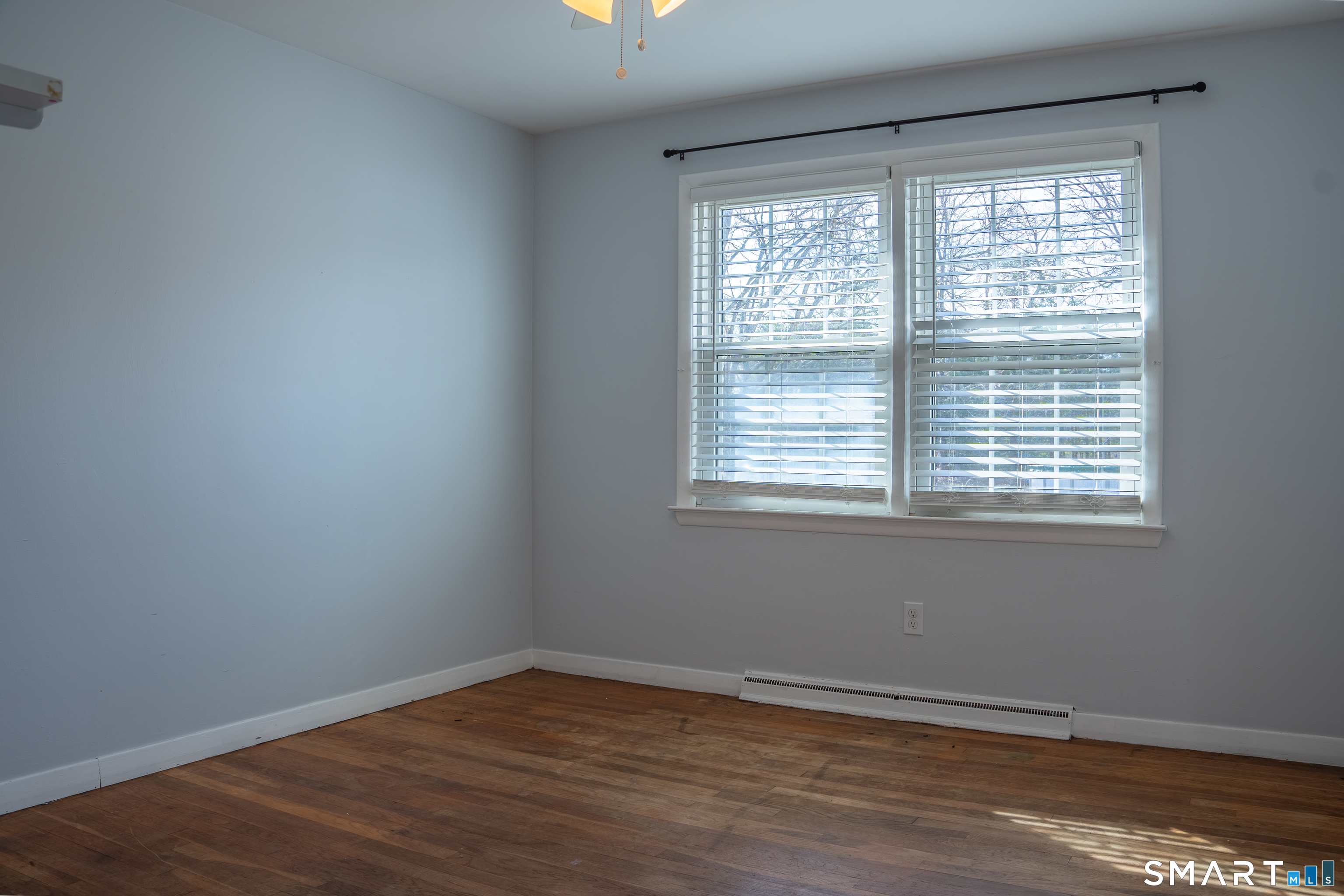 18 Leon Street Thompson, CT 06277 - Photo 13 of 17 a view of an empty room with wooden floor and a window