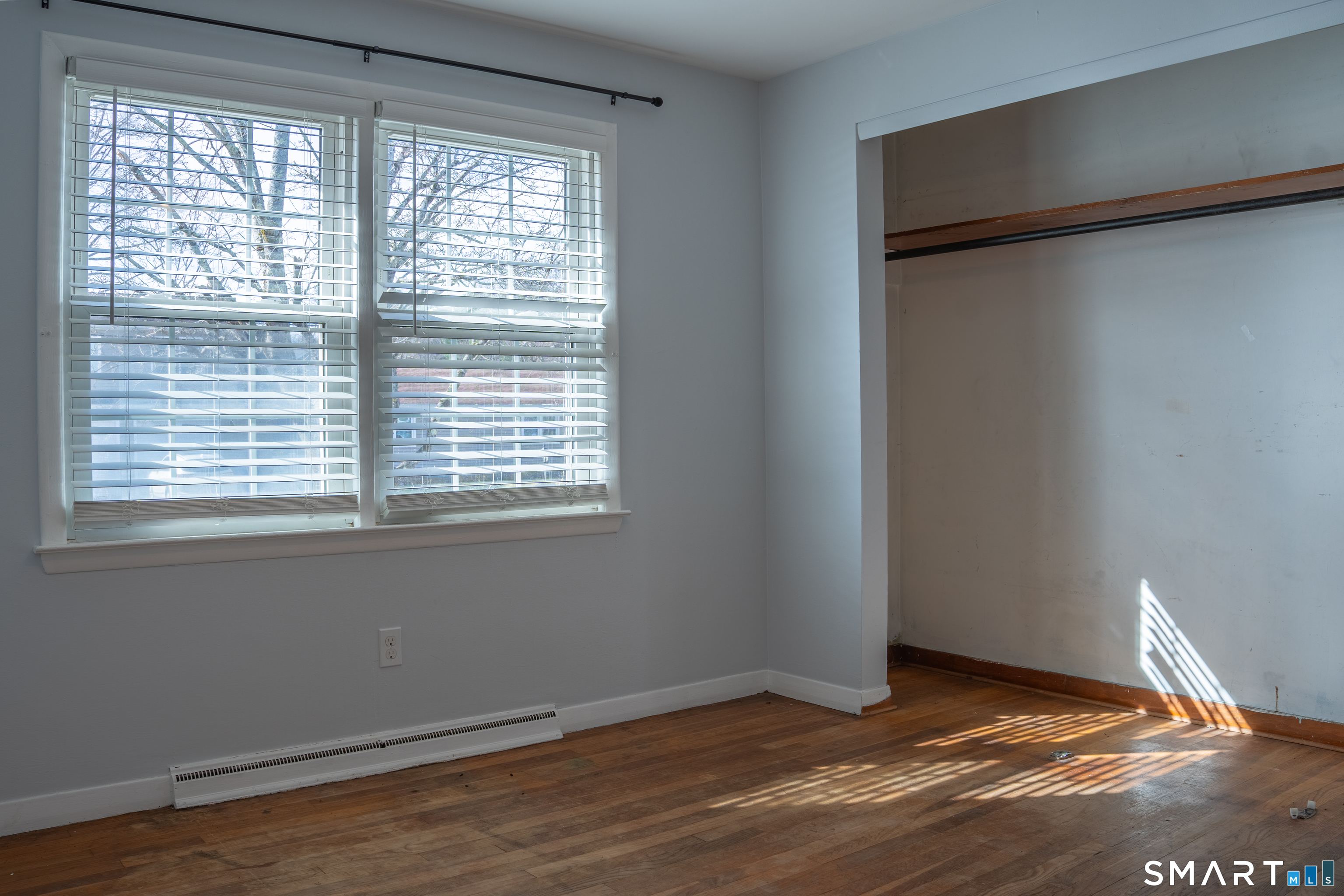 18 Leon Street Thompson, CT 06277 - Photo 14 of 17 a view of an empty room with wooden floor and a window
