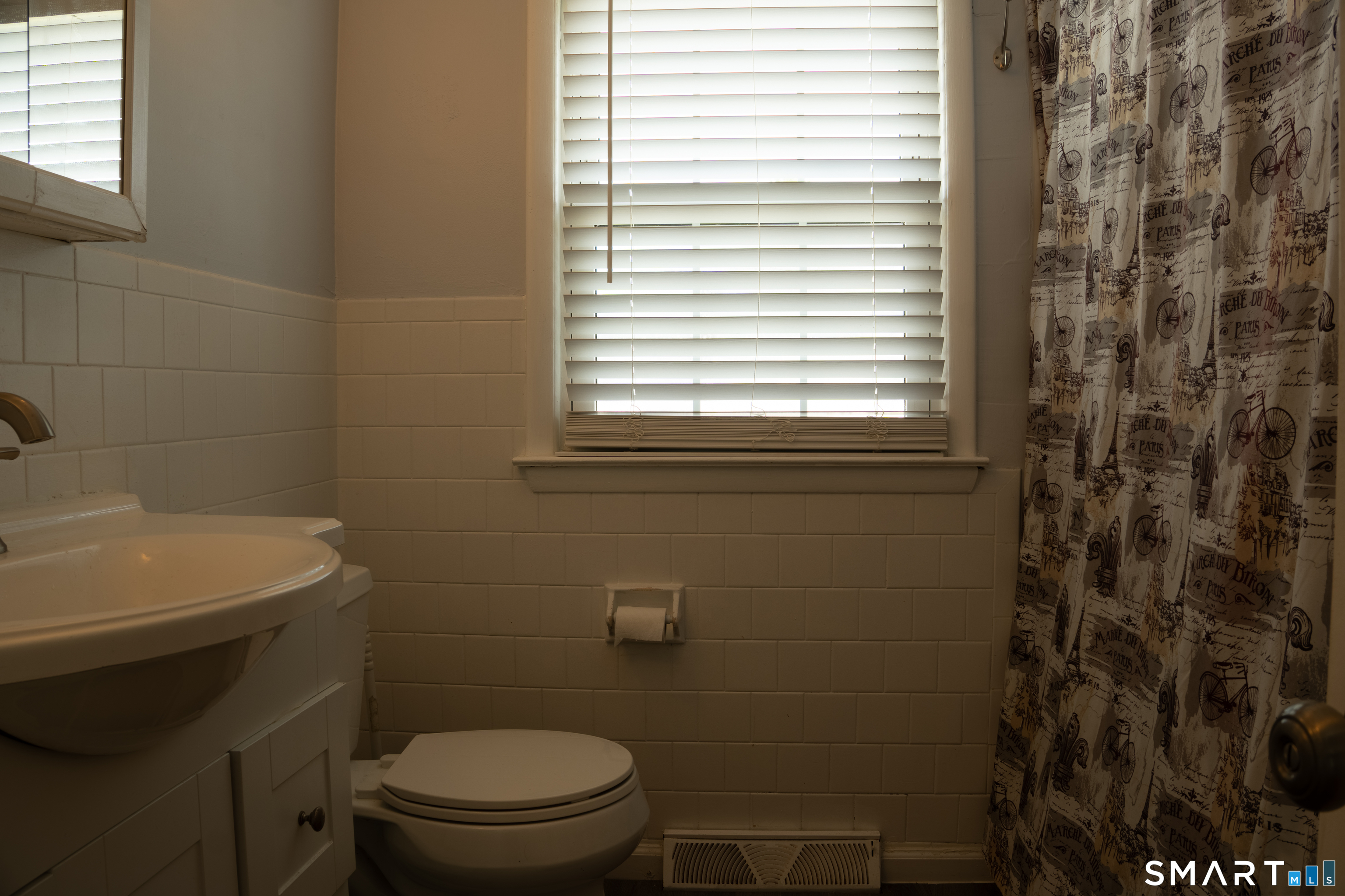18 Leon Street Thompson, CT 06277 - Photo 15 of 17 a bathroom with a toilet a sink and a window