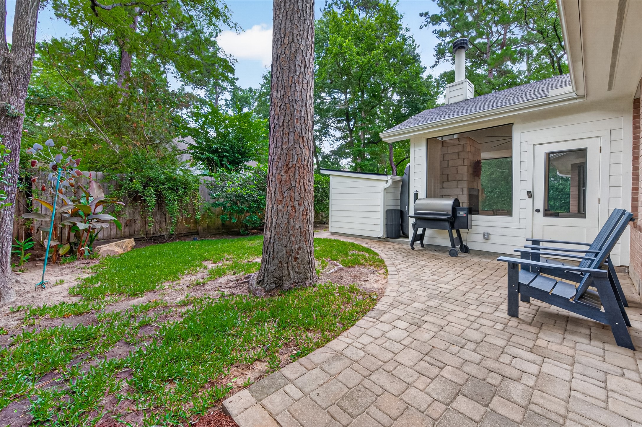 10 Belcarra Place Spring, TX 77382 - Photo 39 of 49 Backyard outside patio just off the enclosed patio with pavers.