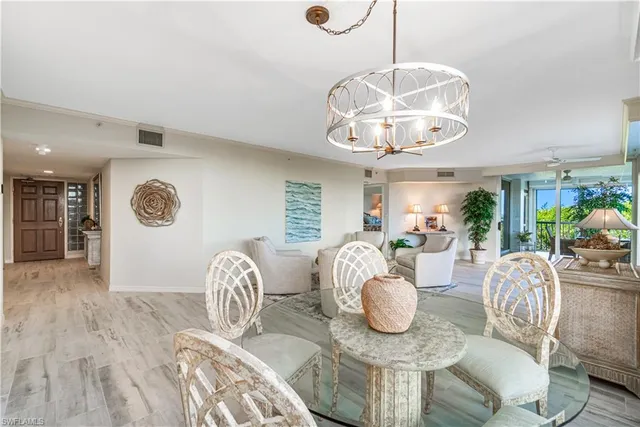a very nice looking dining room with furniture