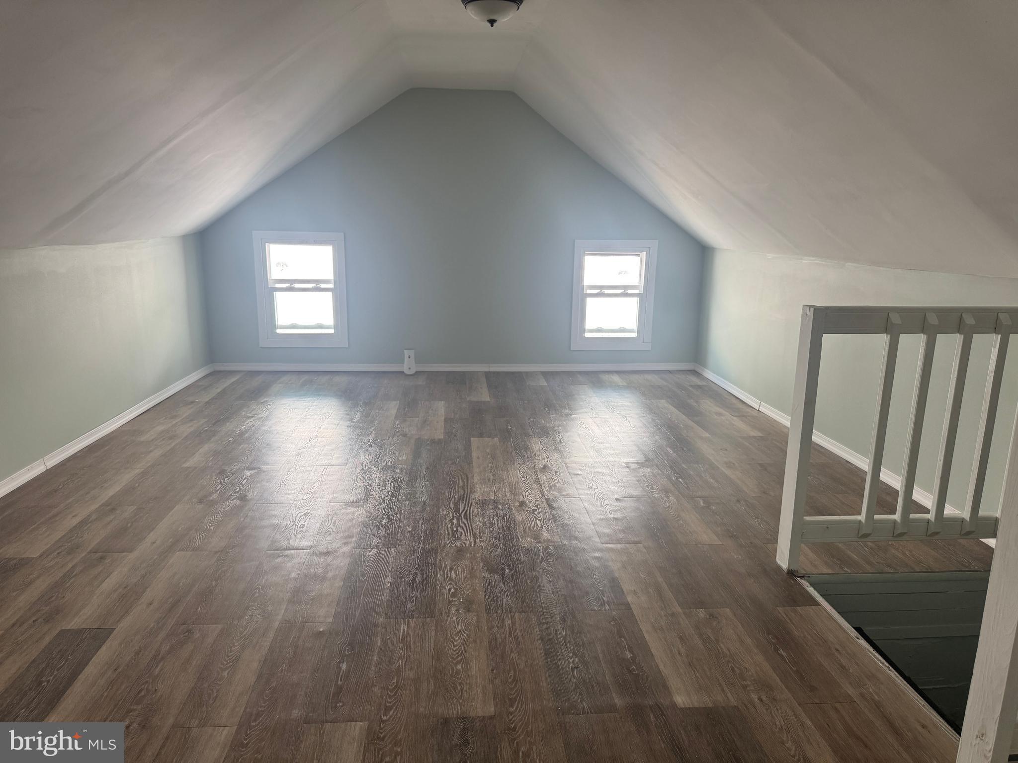 3754 Baltimore Pike, Unit 3 Littlestown, PA 17340 - Photo 16 of 21 an empty room with wooden floor and windows