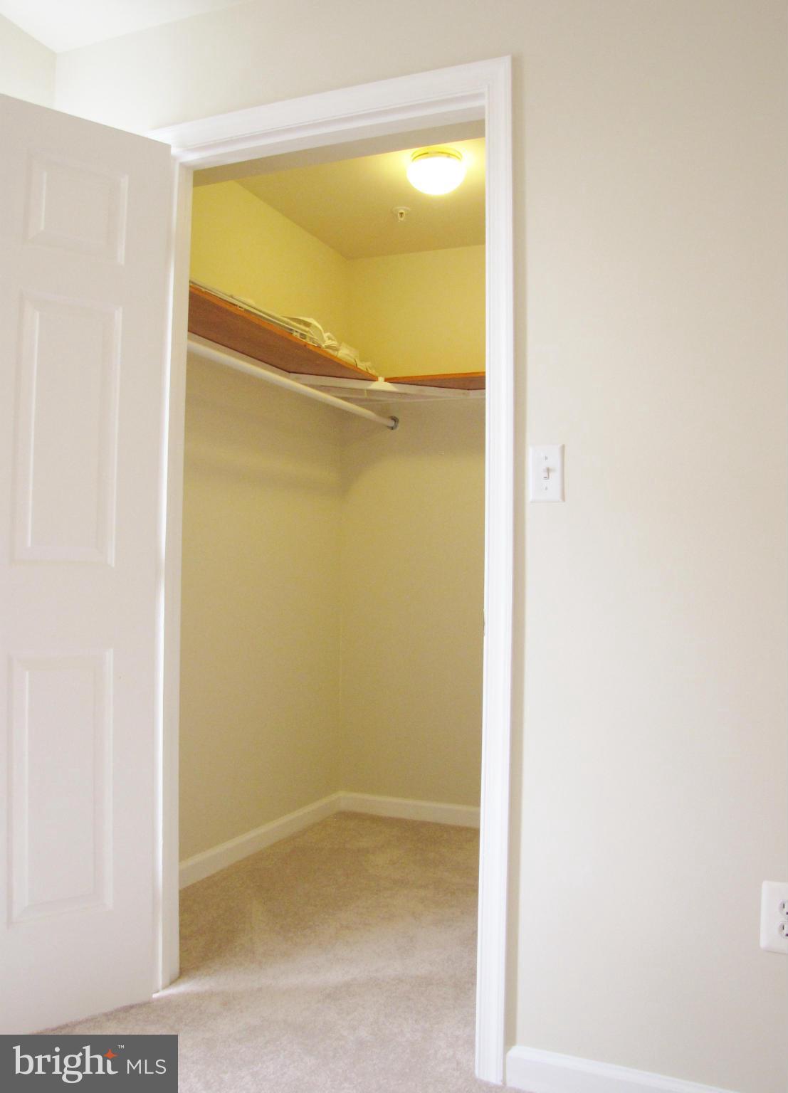 635 Constellation Square Southeast, Unit E Leesburg, VA 20175 - Photo 16 of 20 a bathroom with a glass shower door